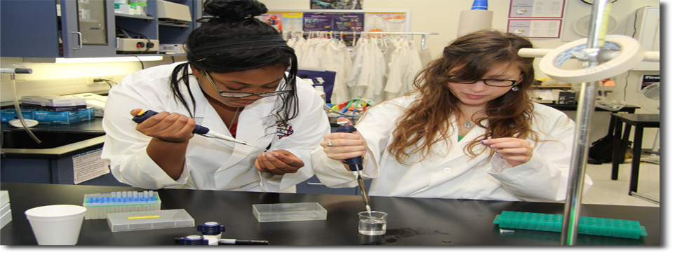 Two female students in a science lab