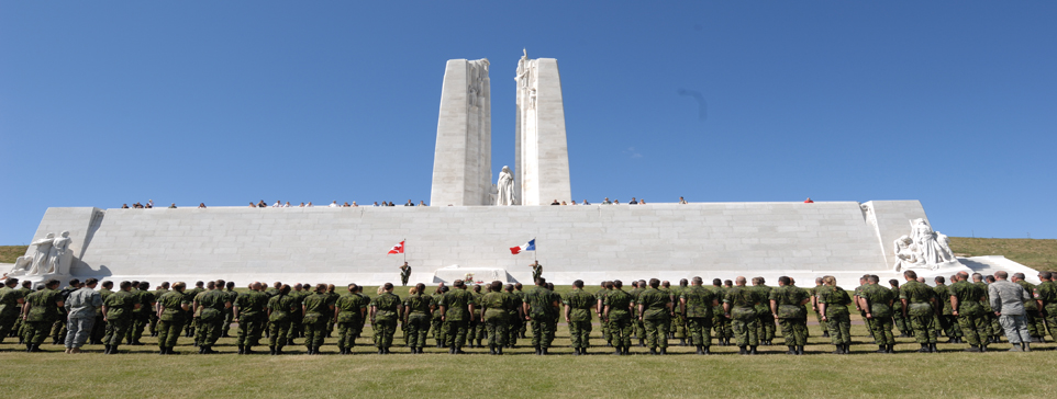 Vimy Ridge with Canadian Soldiers standing at attention 